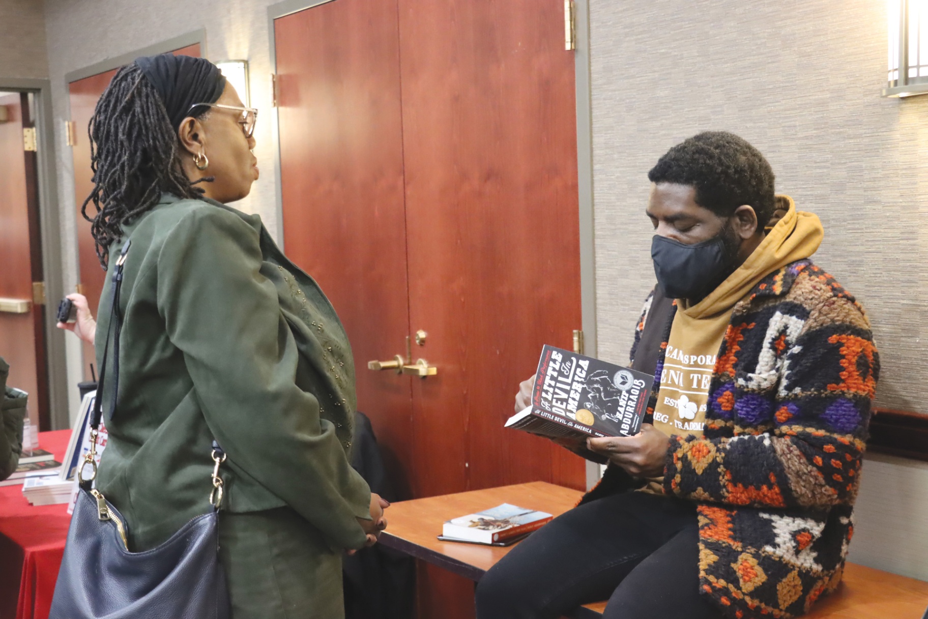Author shares experiences with race and politics in public reading